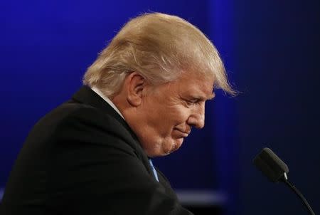 Republican U.S. presidential nominee Donald Trump listens during the first debate with Democratic U.S. presidential nominee Hillary Clinton at Hofstra University in Hempstead, New York, U.S., September 26, 2016. REUTERS/Brian Snyder