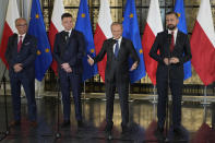 Opposition party leaders, from left, Wlodzimierz Czarzasty, Szymon Holownia, Donald Tusk and Władyslaw Kosiniak-Kamysz announce to reporters that Tusk is their candidate for prime minister and that they are ready to govern together, in Warsaw, Poland, on Tuesday Oct. 24, 2023. The parties together won a majority of seats in parliament in an election on Oct. 15. The current conservative nationalist ruling party, Law and Justice, won more votes than any other party but has no coalition partner and no apparent path to keeping power. (AP Photo/Czarek Sokolowski)