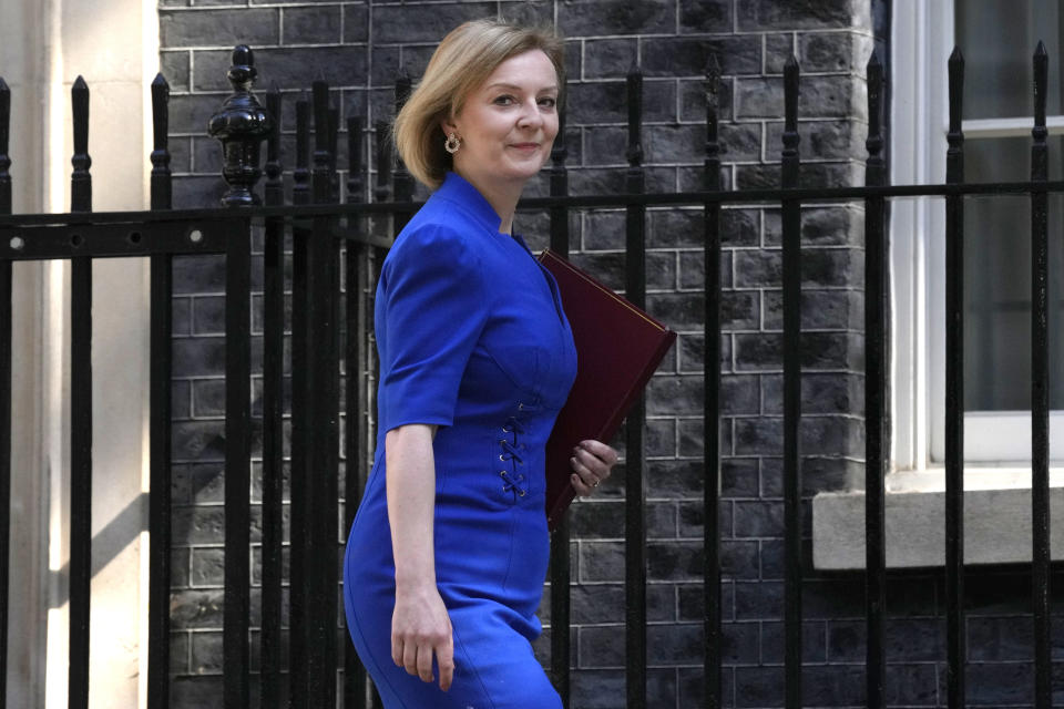 FILE - Britain's Foreign Secretary Liz Truss arrives for a cabinet meeting at 10 Downing Street in London, Tuesday, June 7, 2022. Two people are running to be Britain’s next prime minister, but a third presence looms over the contest: Margaret Thatcher. Almost a decade after her death, the late former prime minister casts a powerful spell over Britain's Conservative Party. In the race to replace Boris Johnson as Conservative leader and prime minister, both Foreign Secretary Liz Truss and former Treasury chief Rishi Sunak claim to embody the values of Thatcher. (AP Photo/Kirsty Wigglesworth, File)