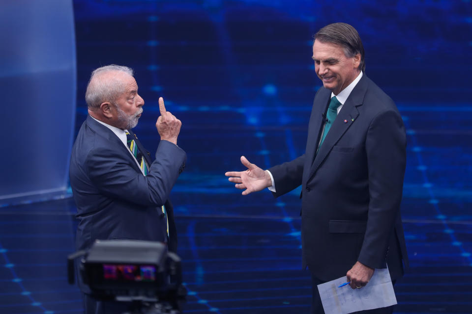 FILE - Brazil's former President Luiz Inacio Lula da Silva, left, and incumbent Jair Bolsonaro, take part in a presidential debate in Sao Paulo, Brazil, Oct. 16, 2022. During the first segment of their first one-on-one debate, they sought to convince poor voters that welfare payments will remain at their value. (AP Photo/Marcelo Chello, File)