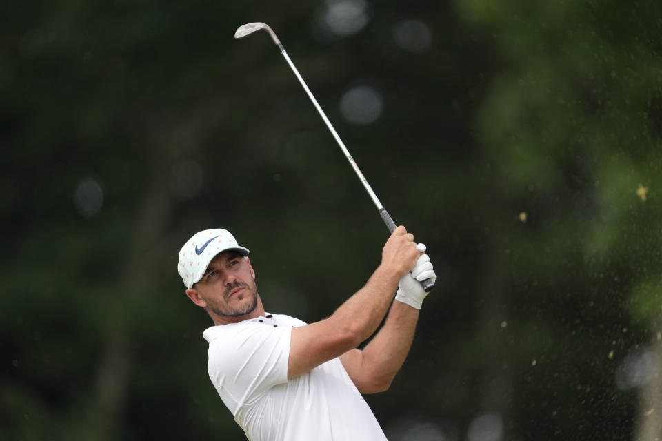 Brooks Koepka watches his shot on the 11th hole during the second round of the U.S. Open golf tournament at The Country Club, Friday, June 17, 2022, in Brookline, Mass. (AP Photo/Robert F. Bukaty)