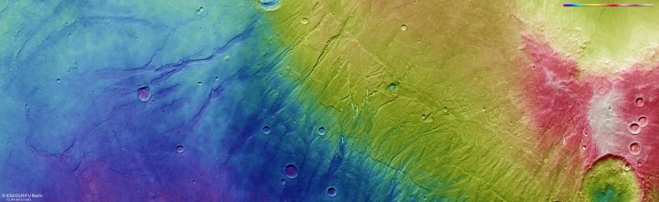 This color-coded topographic image shows Nectaris Fossae and Protva Valles on Mars.