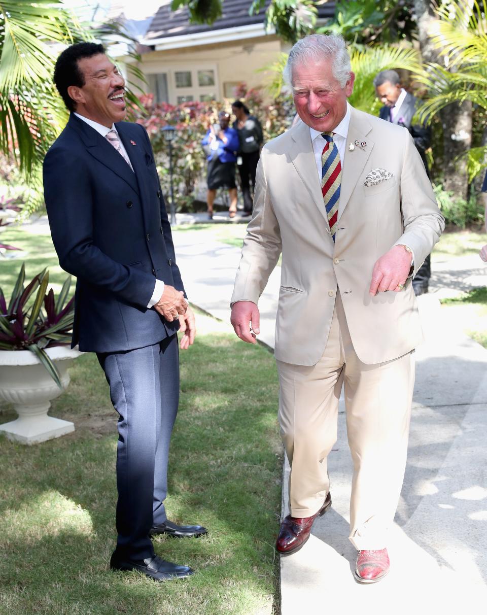 Prince Charles, right, meets Lionel Richie at a Prince's Trust International reception at the Coral Reef Club Hotel in 2019 in Bridgetown, Barbados.