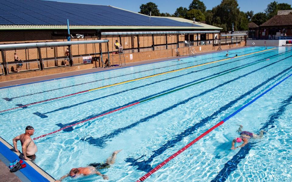 Swimmers enjoy the pool at Woodgreen Leisure Centre, Oxfordshire - New data shows 'extremely low' Covid prevalence in gyms and leisure centres as sector pushes to stay open - PA