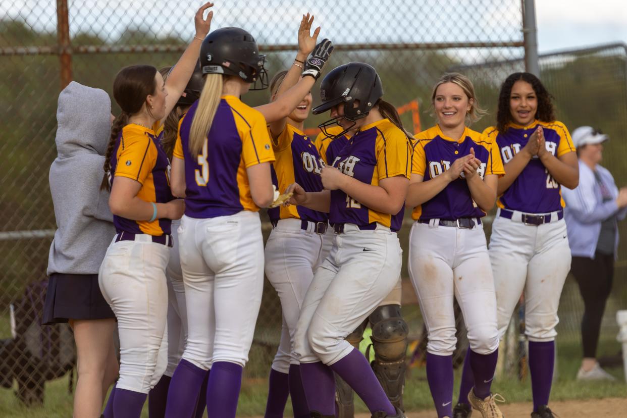 Julia Pinter (42) and her Charger teammates celebrate her home run during OLSH's WPIAL Class 2A Section Three matchup against Washington on April, 30.