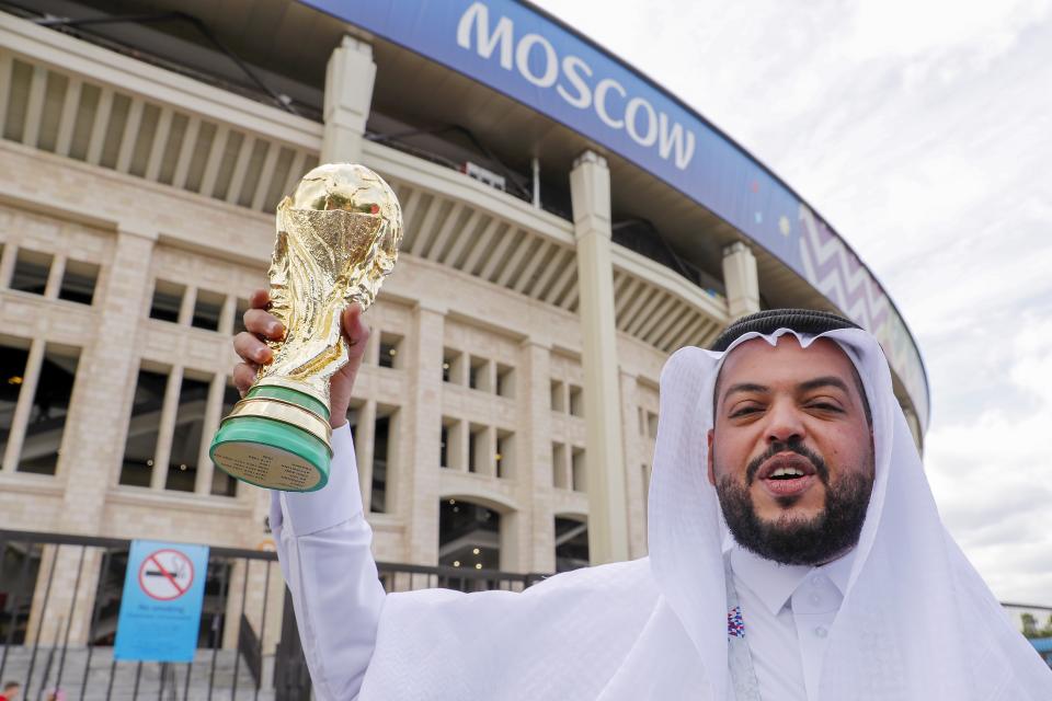<p>Up for the Cup: A Saudi Arabia fan with a replica World Cup trophy at the Luzhniki Stadium. (PA) </p>