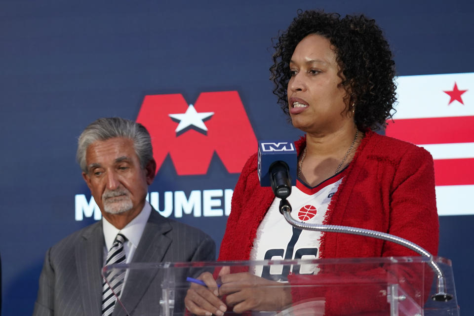 Washington DC Mayor Muriel Bowser, right, speaks during a news conference with Ted Leonsis, left, owner of the Washington Wizards NBA basketball team and Washington Capitals NHL hockey team at Capitol One Arena in Washington, Wednesday, March 27, 2024. (AP Photo/Stephanie Scarbrough)