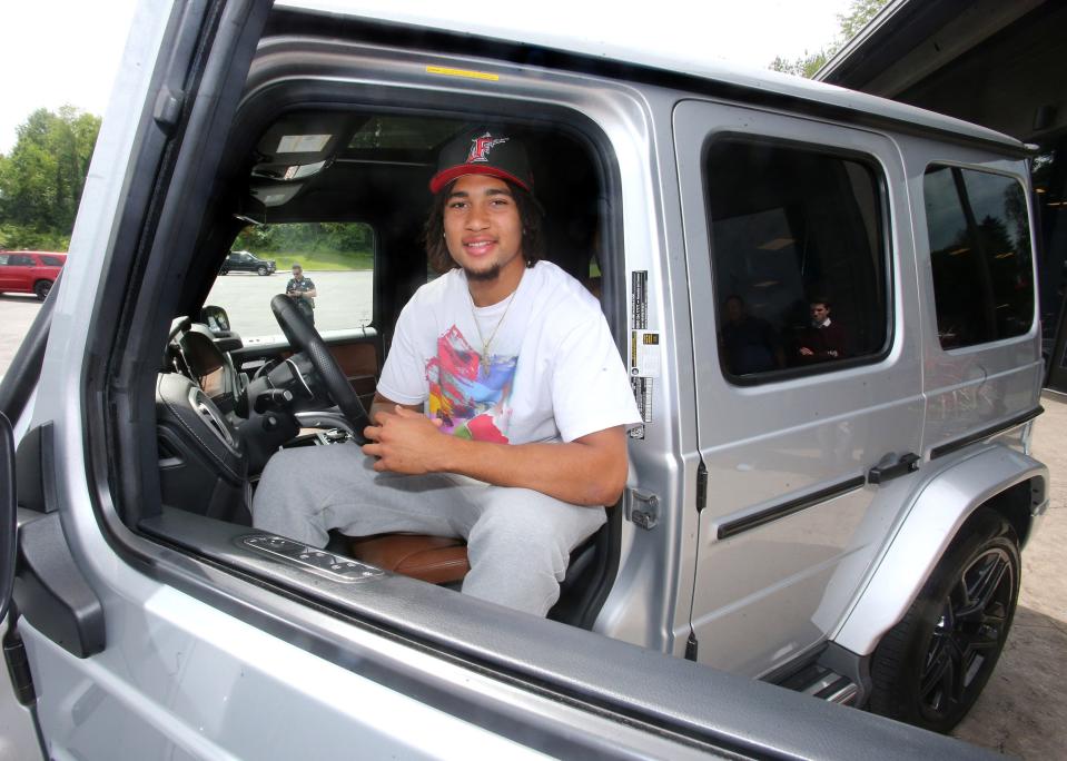 Ohio State quarterback CJ Stroud was all smiles after taking delivery of his Mercedes at Sarchione Auto Gallery in Jackson Township on Wednesday, June 8, 2022.