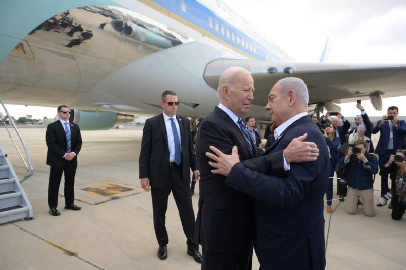 U.S. President Joe Biden (L) embraces Israeli Prime Minister Benjamin Netanyahu (R) upon arrival in Tel Aviv, Israel, on October 18. Tehran was shocked by the intensity of American support for Israel. Photo by Israeli PM Press Service/UPI