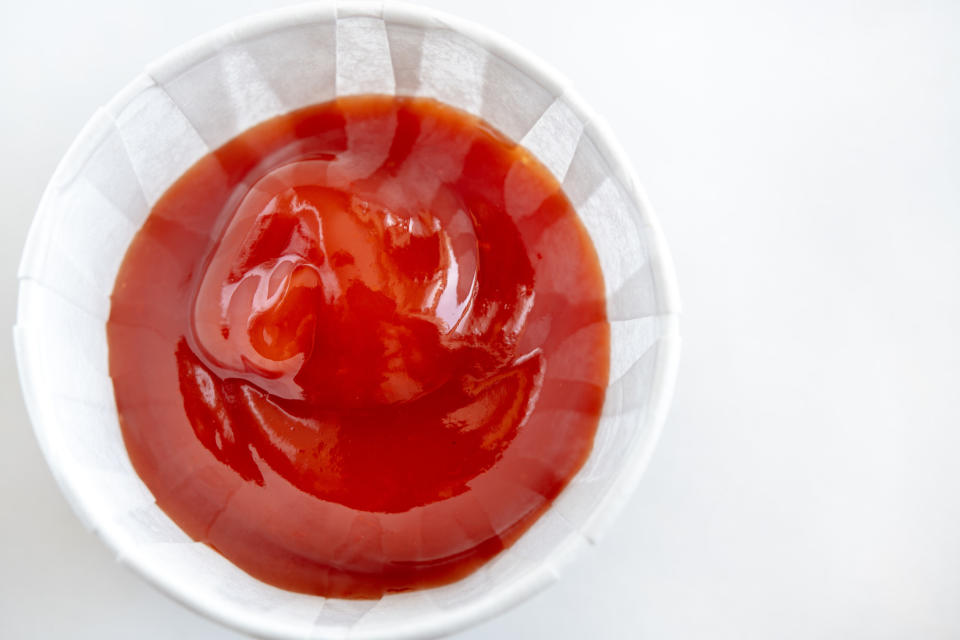 little container of ketchup