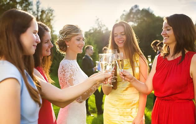 A wedding guest has been shamed for wearing the same dress to three weddings. Photo: Getty