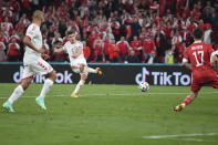 Denmark's Joakim Maehle scores his side's fifth goal during the Euro 2020 soccer championship group B match between Russia and Denmark at the Parken stadium in Copenhagen, Denmark, Monday, June 21, 2021. (Stuart Franklin/Pool via AP)