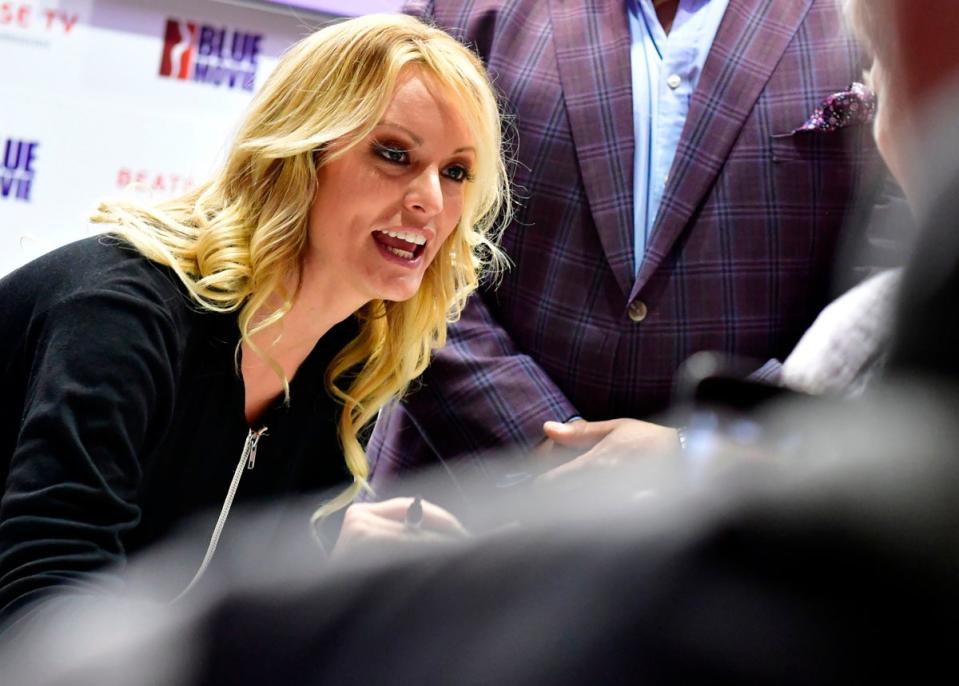 Adult film actress Stormy Daniels signs autographs at the Venus Fair for Erotic Entertainment and Lifestyle on October 12, 2018 in Berlin (AFP via Getty Images)