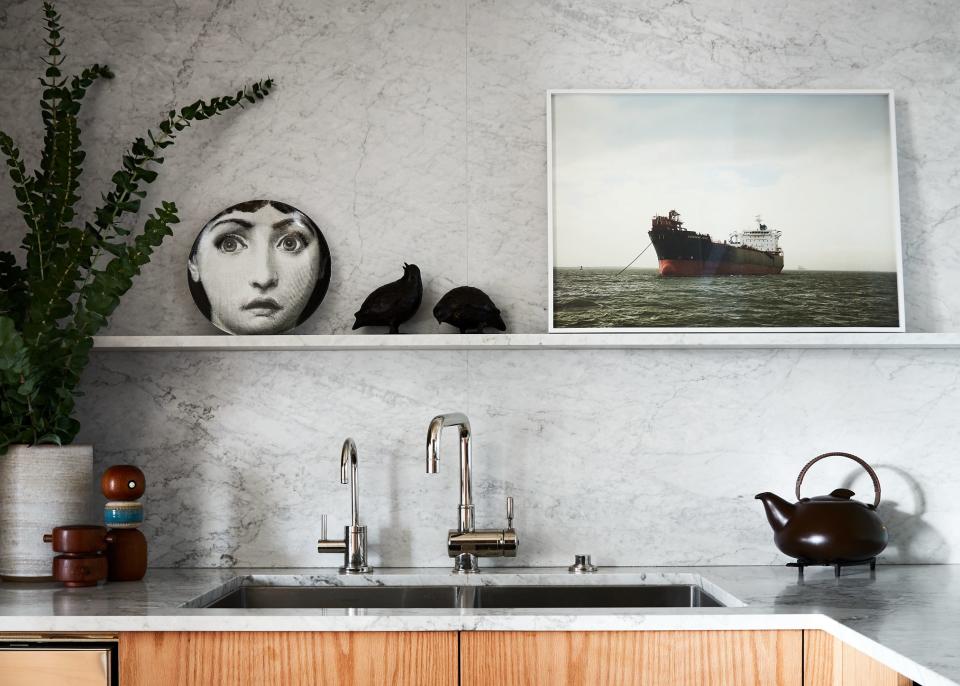 A Fornasetti plate and a ship photograph by Victoria Sambunaris are displayed in Johanknecht’s kitchen.