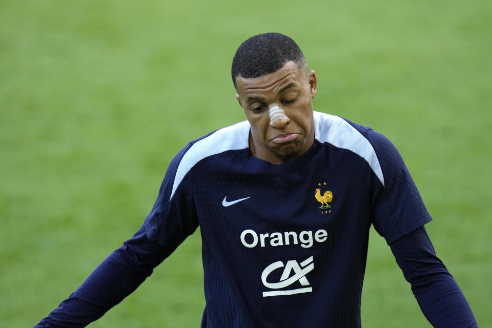 France's Kylian Mbappe gestures as he leaves the field after a training session in Paderborn, Germany, Wednesday, June 19, 2024. France will play against Netherland during their Group D soccer match at the Euro 2024 soccer tournament on June 21. (AP Photo/Hassan Ammar)