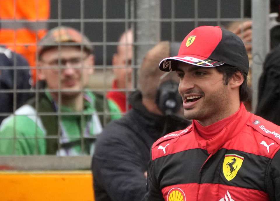 Ferrari driver Carlos Sainz of Spain celebrates after he clocked the fastest time during the qualifying session for the British Formula One Grand Prix at the Silverstone circuit, in Silverstone, England, Saturday, July 2, 2022. The British F1 Grand Prix is held on Sunday July 3, 2022. (AP Photo/Frank Augstein)