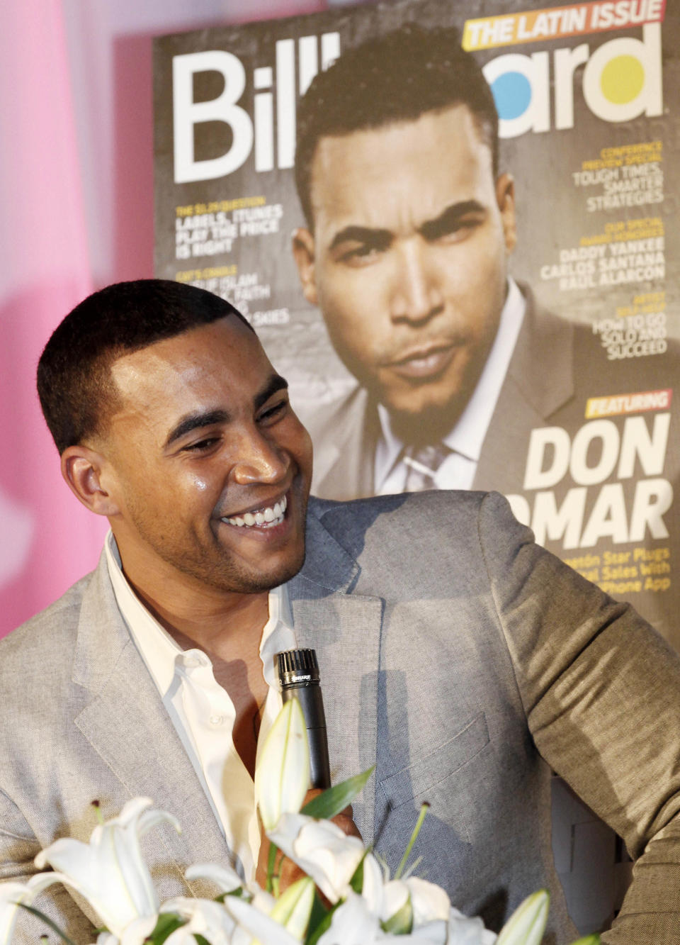 Puerto Rican reggaeton singer-rapper Don Omar smiles as he talks to a reporter in Miami, Tuesday, April 24, 2012. Don Omar is the is the leading finalist in the 2012 Billboard Latin Music Awards. (AP Photo/Alan Diaz)