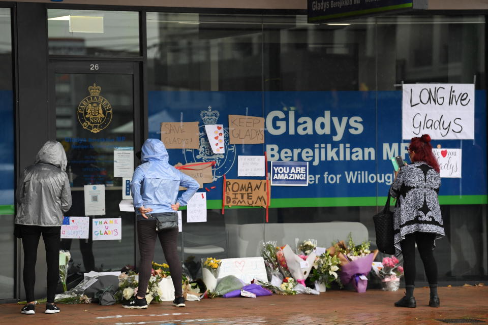 Flowers and signs are left by members of the public for Gladys Berejiklian outside her Northbridge office. Source: Getty