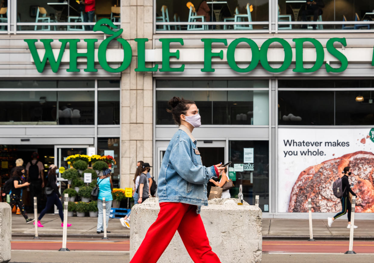 A person wears a face mask outside Whole Foods Market in Union Square as the city continues Phase 4 of re-opening following restrictions imposed to slow the spread of coronavirus on September 29, 2020, in New York City. (Photo by Noam Galai/Getty Images)