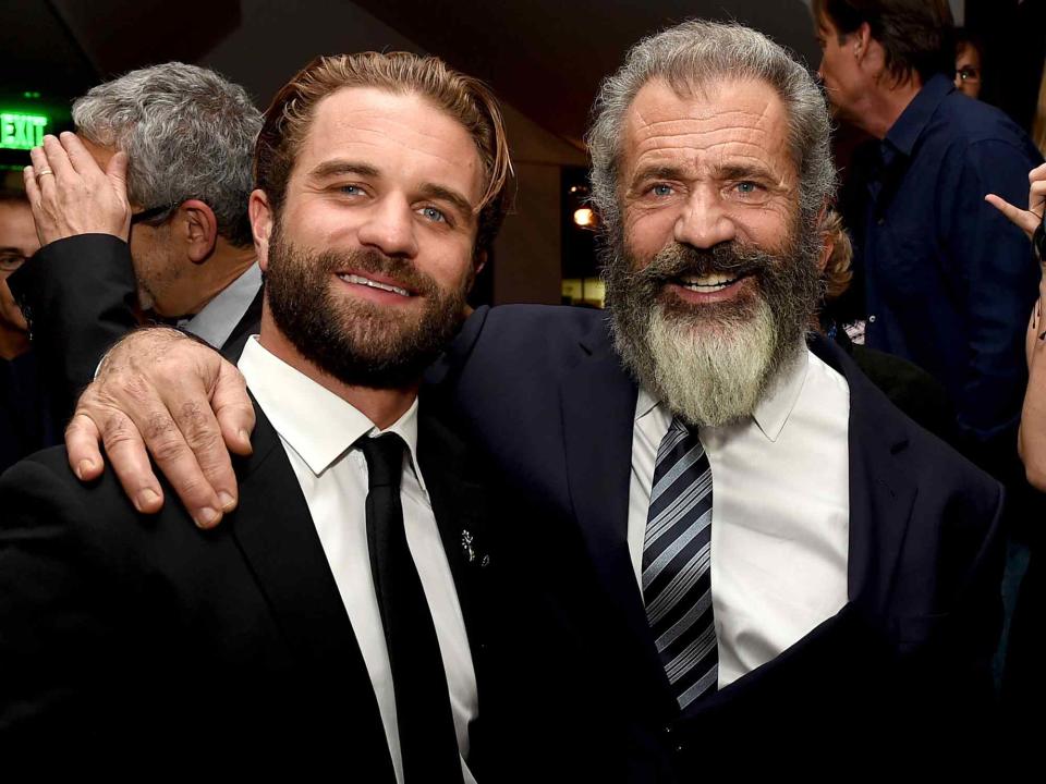 <p>Kevin Winter/Getty</p> Mel Gibson (R) and his son actor Milo Gibson pose at the after party for a screening of Summit Entertainment