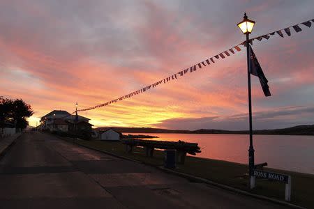 The sun is seen at dusk in Stanley, Falklands Islands, June 13, 2012. REUTERS/Enrique Marcarian/File Photo