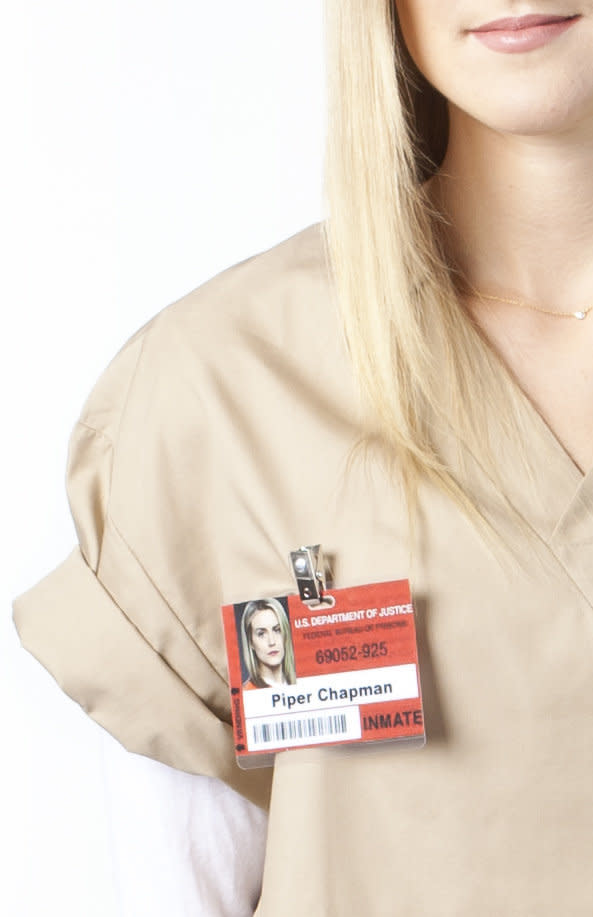 Create your own prison name tag by grabbing a U.S. Bureau of Prisons ID card off of the Internet and Photoshopping in a name and picture. Get it laminated at your local copy center.  