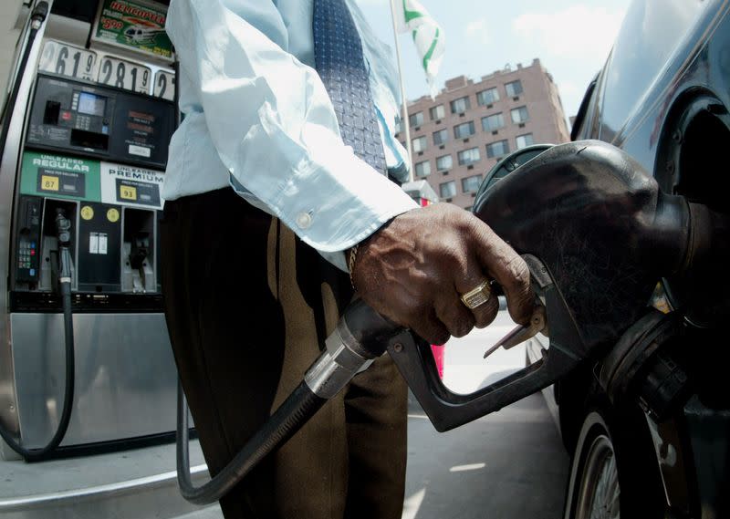 Customer fills up his vehicle with gasoline in New York.