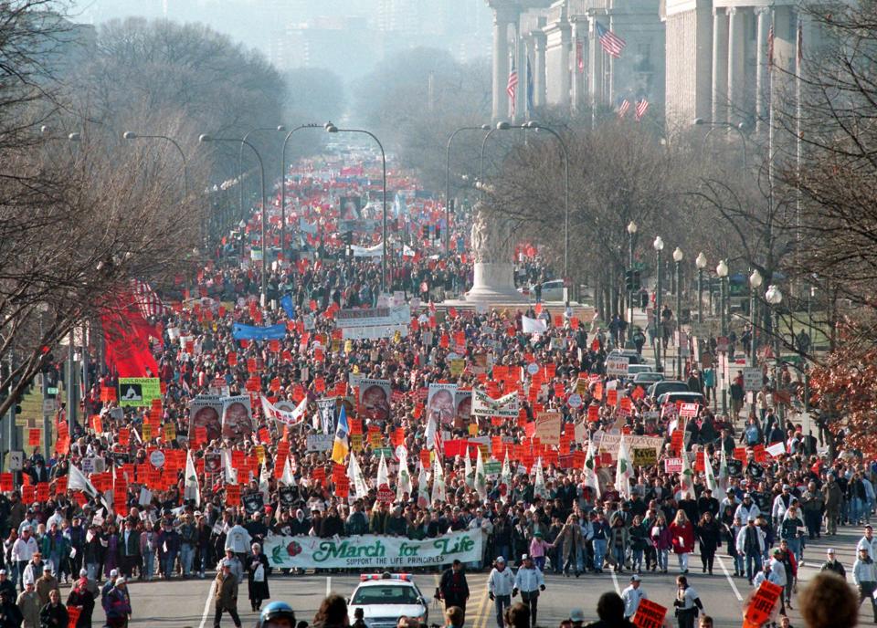 Abortion opponents march down Pennsylvania Avenue in Washington Monday Jan. 22, 1996 toward the Supreme Court to protest the court's 1973 decision to legalize abortion. (AP Photo/Wilfredo Lee)