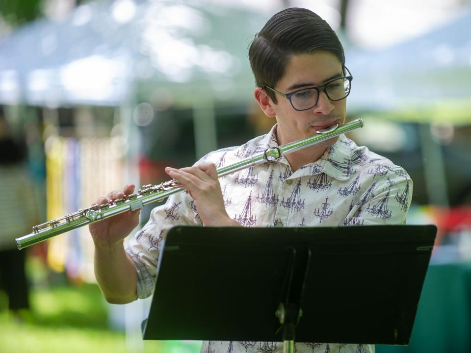 Flutist Devan Jaquez performs during the Music at the Market concert in Walter Hardy Park on Sunday, June 5, 2022. Performed by Knoxville Symphony Orchestra musicians, the concert was held to raise funds for the Austin-East Foundation. 