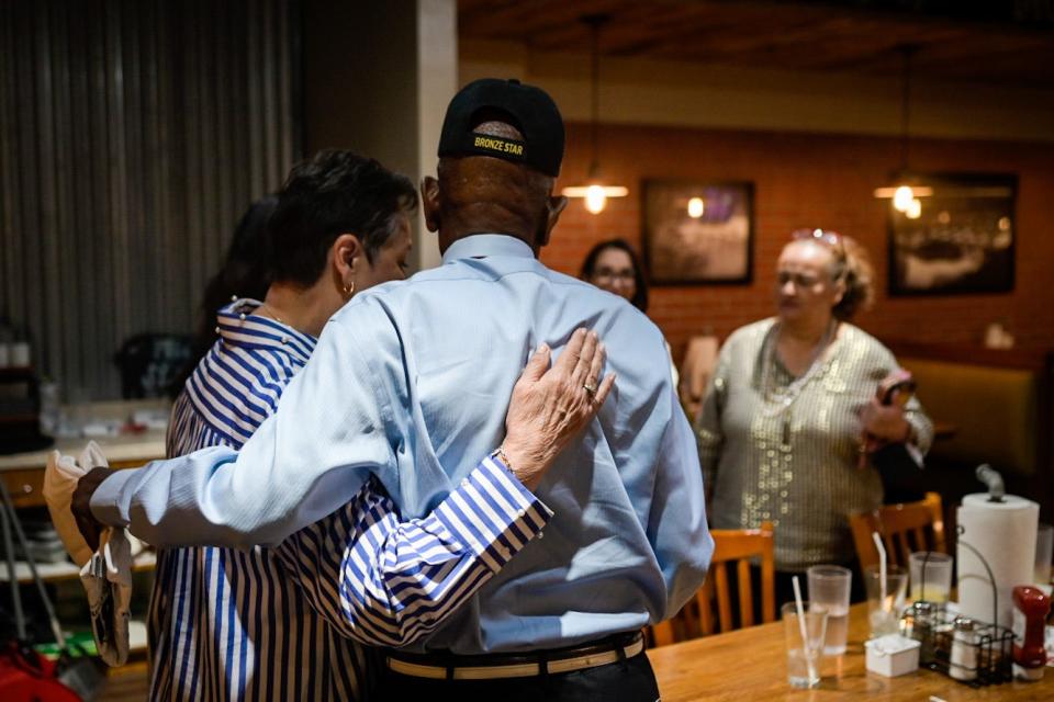 Lily Limon, left, hugs District 4 County Commissioner Carl Robinson before leaving Robinson's watch party at Famous Dave's on Tuesday. Robinson was down by almost 400 votes.