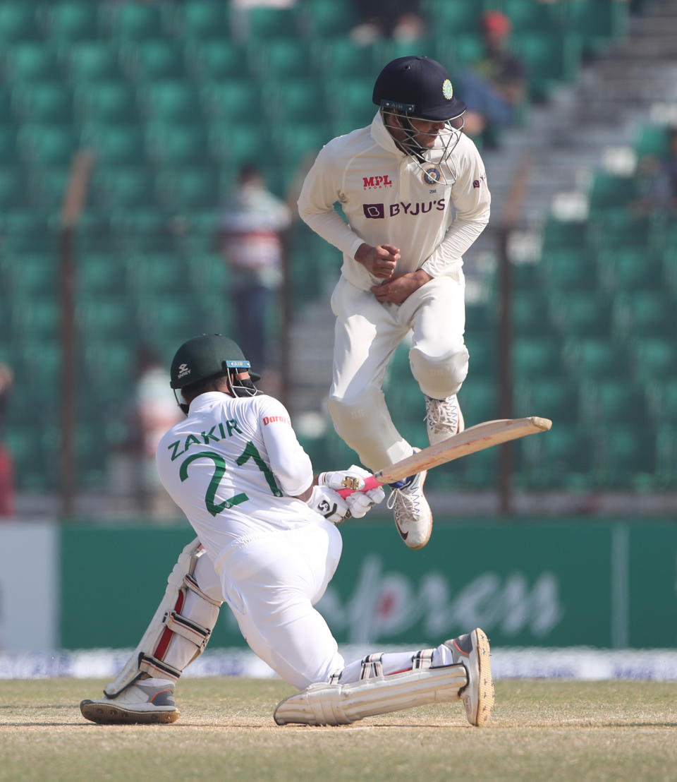 Bangladesh's Najmul Hossain Shanto plays a shot as India's Shubman Gill jumps to save himself during the first Test cricket match on day four between Bangladesh and India in Chattogram Bangladesh, Saturday, Dec. 17, 2022. (AP Photo/Surjeet Yadav)