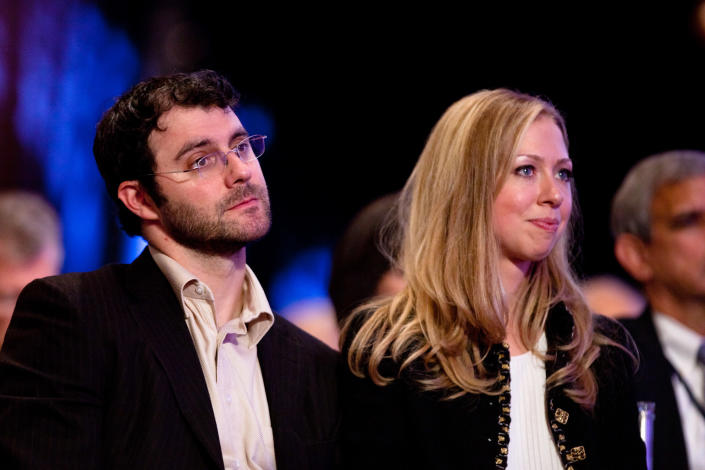 Daughter of former US President Bill Clinton Chelsea Clinton (R) sits with her husband Marc Mezvinsky during the closing Plenary session of the seventh Annual Meeting of the Clinton Global Initiative (CGI) at the Sheraton New York Hotel on September 22, 2011 in New York City. Established in 2005 by former U.S. President Bill Clinton, the CGI assembles global leaders to develop and implement solutions to some of the world's most urgent problems. (Photo by Daniel Berehulak/Getty Images)