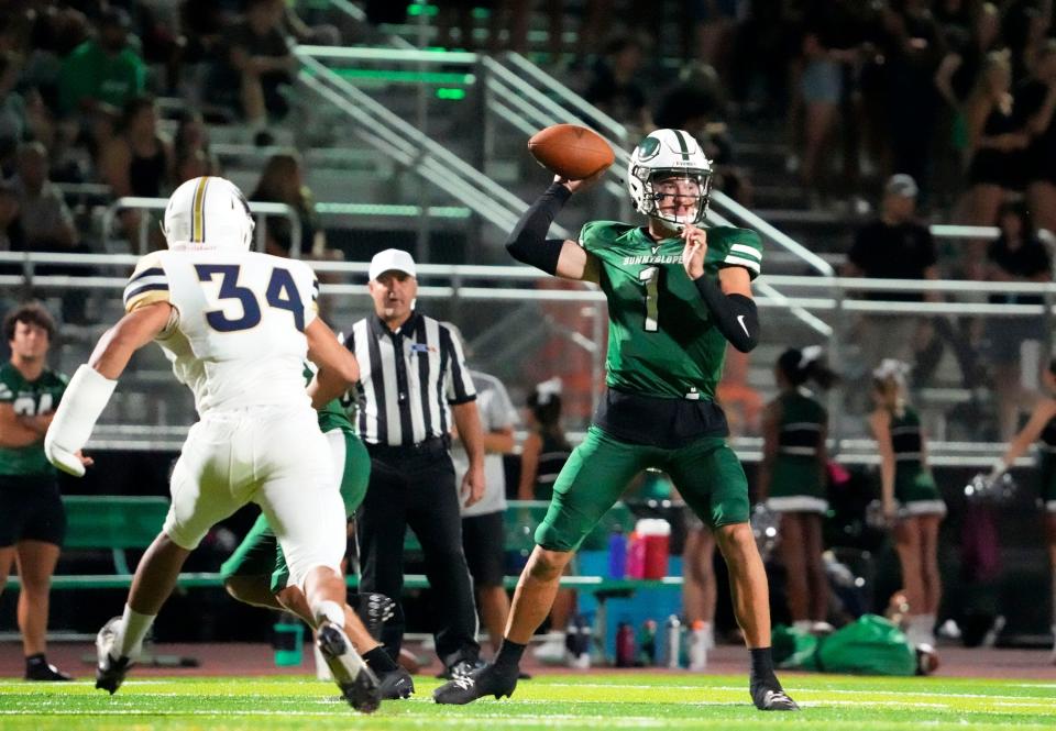 Sunnyslope Vikings quarterback Luke Moga (1) throws a pass against Apollo Hawks defensive end Ahmed Saleh (34) during a game at Sunnyslope High in Phoenix on Sept. 9, 2022.