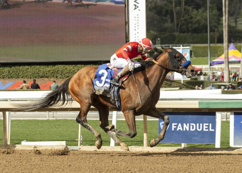 Practical Move, ridden by jockey Ramon Vazquez, sprints to victory in the San Felipe Stakes at Santa Anita Park.