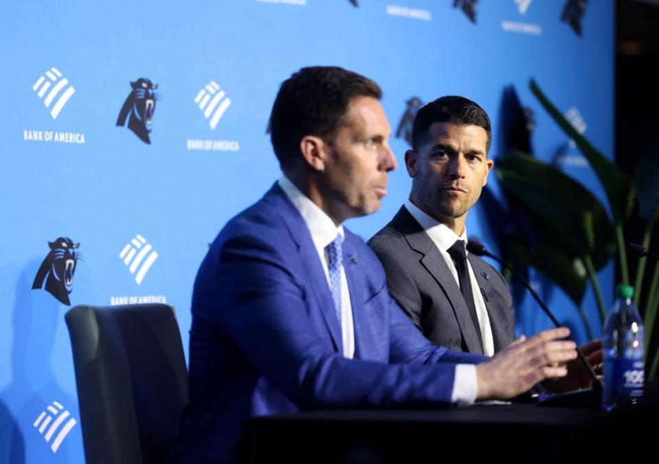 Panthers new head coach Dave Canales, right, listens to Panthers GM Dan Morgan during the introduction of the new coach Thursday morning, Feb. 01, 2024. Khadejh Nikouyeh/knikouyeh@charlotteobserver.com