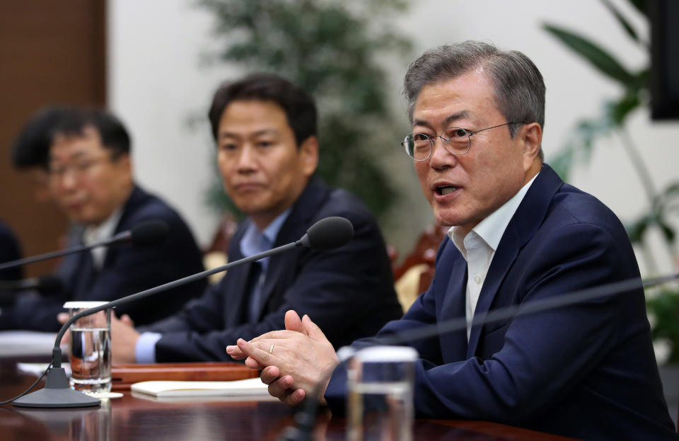 In this Thursday, Sept. 6, 2018 photo, South Korean President Moon Jae-in, right, speaks during a meeting to make preparations for upcoming summit between South and North Korea in Pyongyang, North Korea, from Sept. 18-20 at the presidential Blue House in Seoul, South Korea. Moon said Friday, Sept. 7, that he's pushing for "irrevocable progress" on efforts to rid North Korea of its nukes by the end of this year as he prepares for his third summit with North Korean leader Kim Jong Un. (Hwang Gwang-mo/Yonhap via AP)