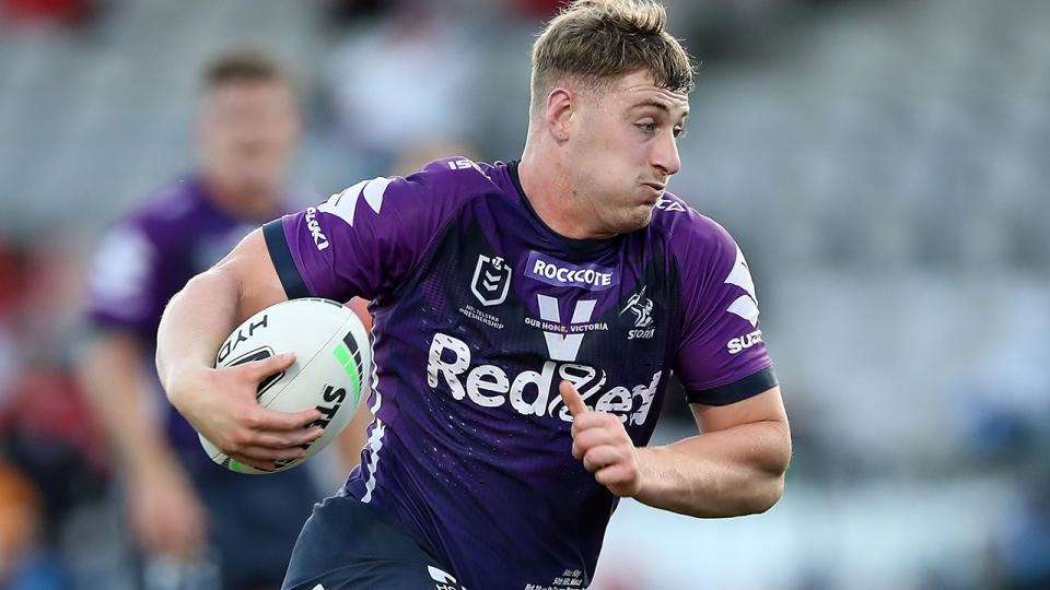 Melbourne Storm's Max King is pictured running the ball during an NRL match.