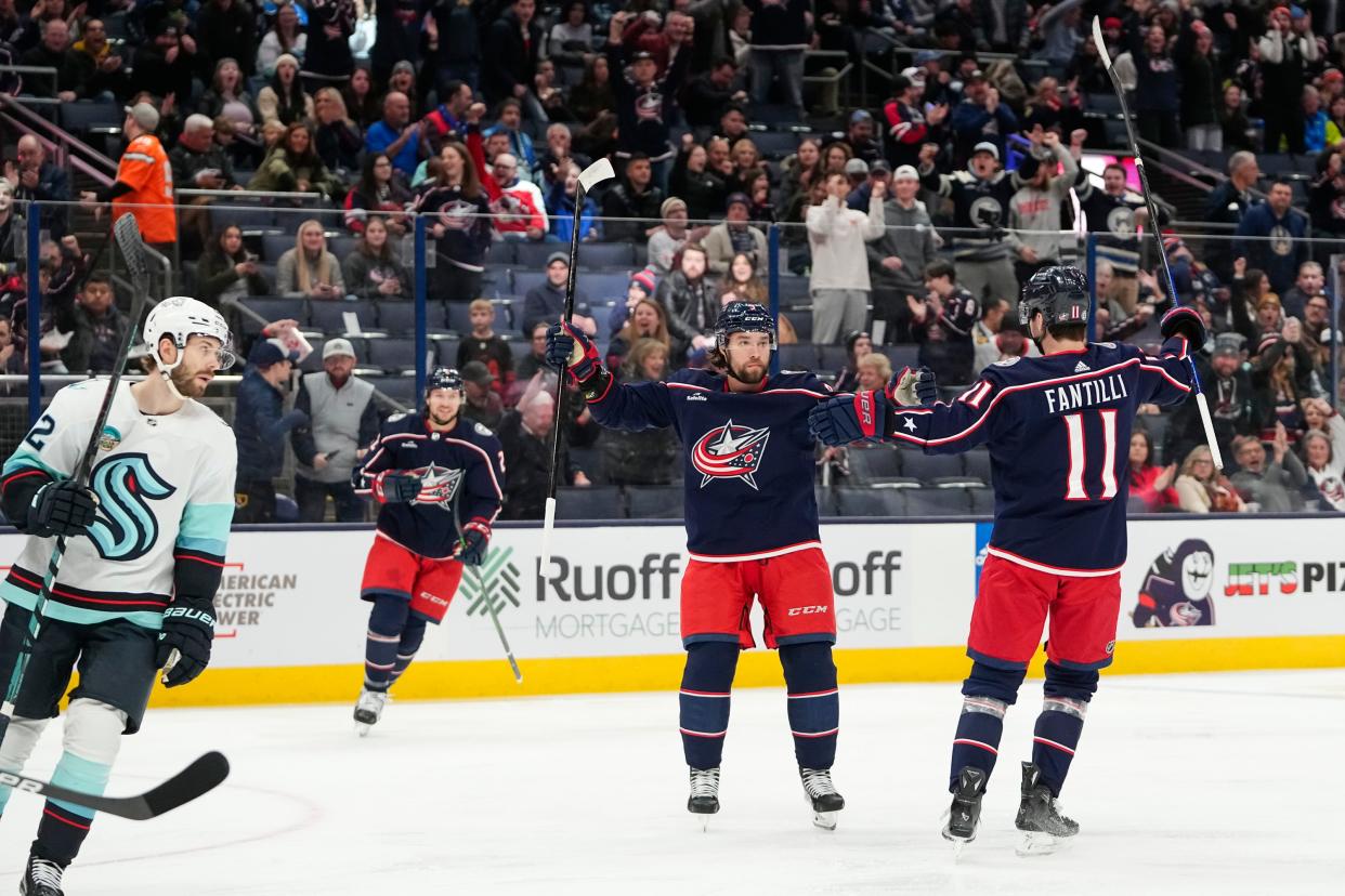 Jan 13, 2024; Columbus, Ohio, USA; Columbus Blue Jackets center Adam Fantilli (11) celebrates a goal by defenseman Ivan Provorov (9) during the first period of the NHL hockey game against the Seattle Kraken at Nationwide Arena.
