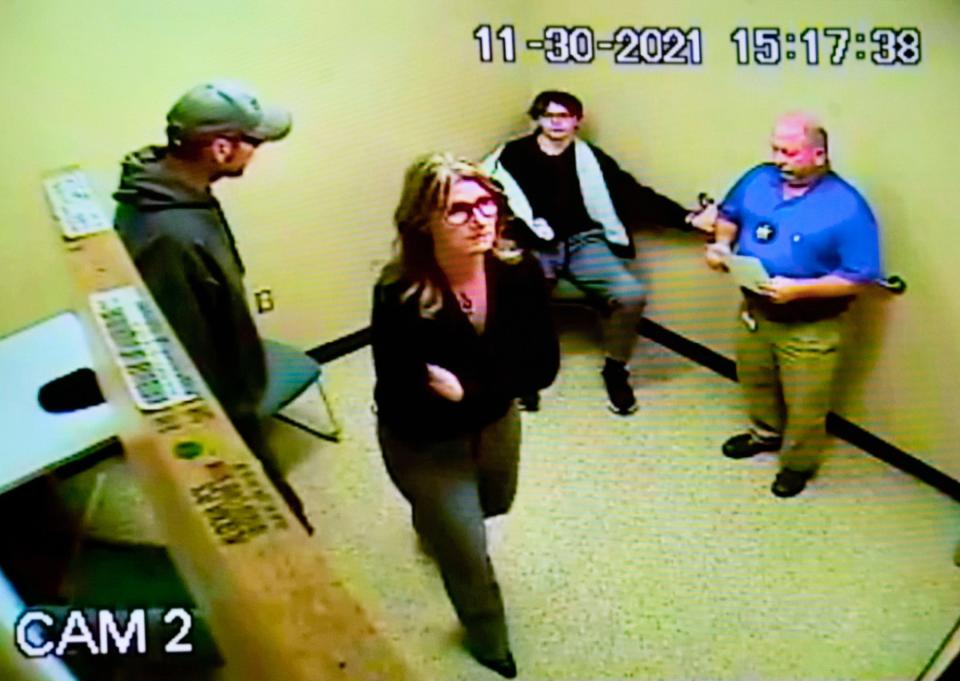 James, left, and Jennifer Crumbley are shown leaving an interview room at the Oakland County Sheriff's department on Nov. 30, 2021 after their son Ethan Crumbley (seated in middle) was being held after he killed four fellow students at Oxford High School. This interview video was evidence showed at the trial of Jennifer Crumbley as she is being tried on four counts of involuntary manslaughter in the Oakland County courtroom of Judge Cheryl Matthews on Monday, Jan. 29, 2024.