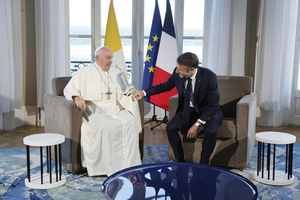 French President Emmanuel Macron and Pope Francis meet at the Palais du Pharo, in Marseille, southern France, Saturday, Sept. 23, 2023. Pope Francis blasted the "fanaticism of indifference" that greets migrants seeking a better life in Europe, as he arrived Friday in the Mediterranean port of Marseille amid a new influx of would-be refugees from Africa that has sparked a backlash from some of Europe's increasingly anti-migrant leaders. (Sebastien Nogier, Pool via AP)