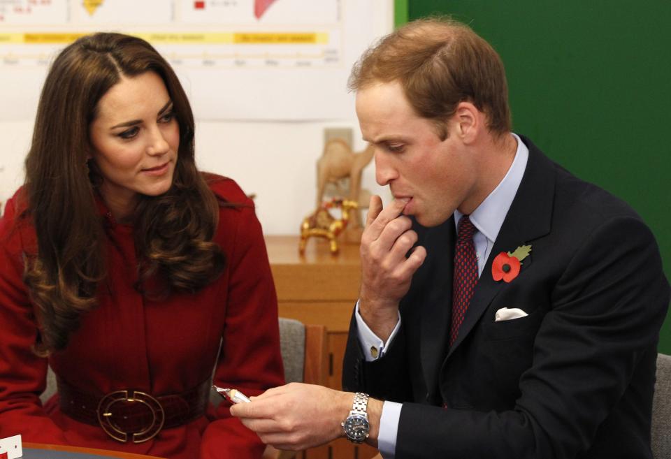 COPENHAGEN, DENMARK - NOVEMBER 2: Prince William, Duke of Cambridge and Catherine, Duchess of Cambridge taste a high energy paste used to treat severe malnutrition during a visit to the UNICEF Emergency Supply Centre on November 2, 2011 in Copenhagen, Denmark. Catherine, Duchess of Cambridge and Prince William, Duke of Cambridge visited the centre to view efforts to distribute emergency food and medical supplies to eastern Africa where severe food shortages are affecting more than 13 million people. (Photo by Phil Noble - WPA Pool/Getty Images)