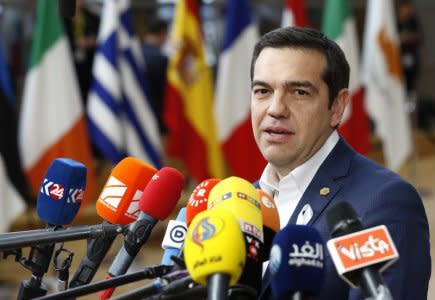 Greek Prime Minister Alexis Tsipras talks to media arrives at a European Union leaders summit in Brussels, Belgium, March 22, 2018. REUTERS/Francois Lenoir