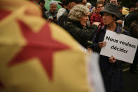 <p>Pro independence supporter hods up a banner close to ”esteladas” or pro independence reading, ”We want to decide” during a rally in support for the secession of the Catalonia region from Spain, in Bilbao, northern Spain, Saturday, Sept. 16, 2017. (Photo: Alvaro Barrientos/AP) </p>