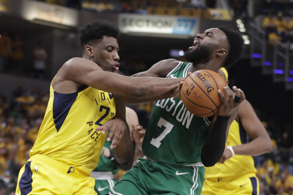 Indiana Pacers forward Thaddeus Young (21) blocks the shot of Boston Celtics guard Jaylen Brown (7) during the second half of Game 3 of an NBA basketball first-round playoff series Friday, April 19, 2019, in Indianapolis. (AP Photo/Darron Cummings)