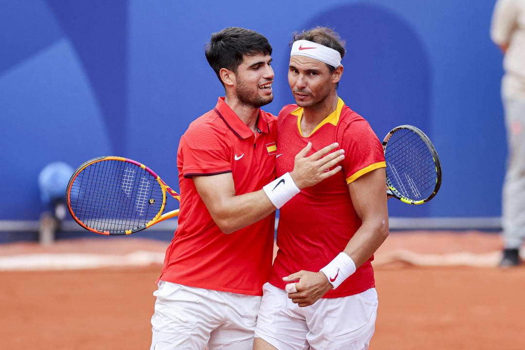 Carlos Alcaraz of Spain and Rafael Nadal of Spain during the Men's Tennis Doubles Second Round match between Spain and Netherlands on Day 4 of the Olympic Games Paris 2024 at Roland-Garros Stadium on July 30, 2024 in Paris, France. (Photo by Henk Jan Dijks/Marcel ter Bals/DeFodi Images/DeFodi via Getty Images)