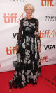 <p>Helen Mirren attended the “Eye In The Sky” premiere during the 2015 Toronto International Film Festival in a black and white Valentino gown with flowers that was fun and fresh on the 70 year old actress.</p>