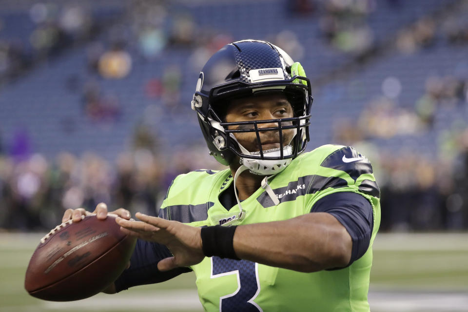 Seattle Seahawks quarterback Russell Wilson warms up before an NFL football game against the Minnesota Vikings, Monday, Dec. 2, 2019, in Seattle. (AP Photo/Ted S. Warren)