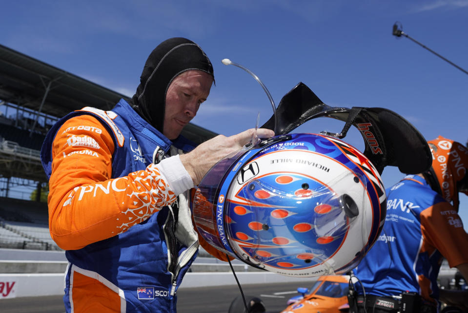 Scott Dixon, of New Zealand, takes off his helmet following the final practice session for the Indianapolis 500 auto race at Indianapolis Motor Speedway, Friday, Aug. 21, 2020, in Indianapolis. (AP Photo/Darron Cummings)