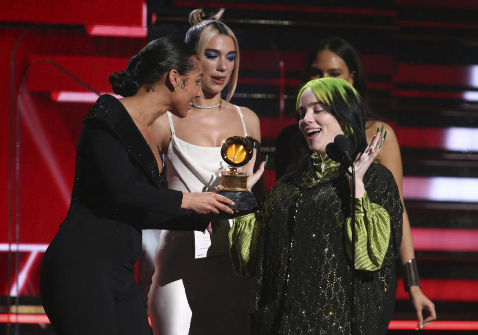 Alicia Keys, from left, and Dua Lipa present Billie Eilish with the award for best new artist at the 62nd annual Grammy Awards on Sunday, Jan. 26, 2020, in Los Angeles. (Photo by Matt Sayles/Invision/AP)