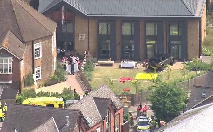 The Study Prep girls elementary school is seen in Wimbledon, London, on July 6, 2023, after a woman crashed her SUV, seen at top right, into the school grounds and main building, killing one student and leaving at least six others injured. / Credit: Reuters/UK POOL